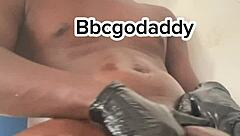 Peek at muscular black bodybuilder jerking off huge oiled cock and fucking toy in bathroom