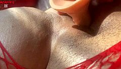 Hey, watch this curvy Latina in red body shoving dildo deep moaning wildly  