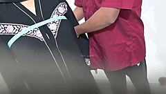 doctor performs routine check on hijab lady in hospital