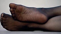Exciting feet display in sleek nylon pantyhose!