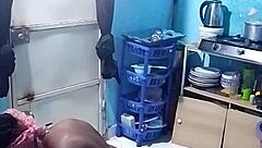 African amateur bends over in kitchen revealing big pussy lips and wet ebony slit