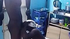 African amateur bends over in kitchen revealing big pussy lips and wet ebony slit