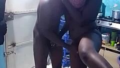 African amateur bends over in kitchen revealing big pussy lips and wet ebony slit