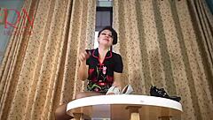 Curvy housewife in pantyhose and heels teases with striptease at round table