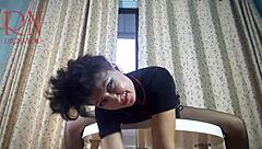 Curvy housewife in pantyhose and heels teases with striptease at round table