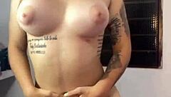 Tease your eyes on this cute young Latina's big tits