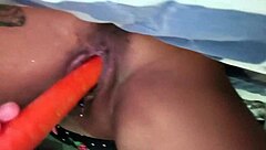 brazilian milf squirts wildly fingering pussy with carrot