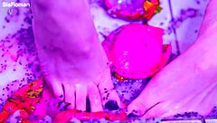 bare toes smash juicy fruit so close up