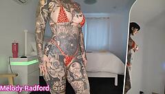 Watch her huge fake tits burst from micro bikini haul