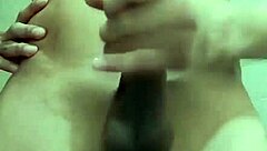 Skinny guy strokes huge cock in work bathroom solo