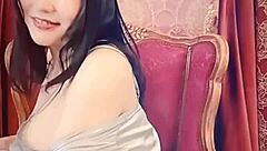 Japanese Milf's Big Tits Spill from Blue Satin Webcam Tease