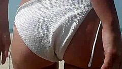 fat ass pees white bikini on crowded public beach!