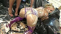 lesbian babes smear food on bodies while licking pussies wildly