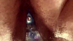 up close curvy hairy pussy takes glass dildo deep