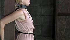 blonde skank locked in stocks for brutal bondage humiliation