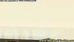 fetish babe rubs clit under golden shower stream