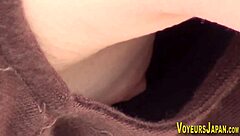 Voyeur peeps asian babe's side boob and small nipples outdoors