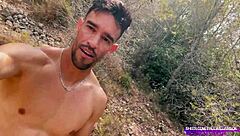 Muscular stud naked jerking huge cock deep in the forest outdoors