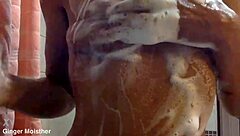 Ginger's wet soapy nipples tits belly closeup in ripped jeans