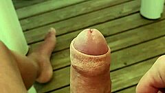 Naked camper strokes huge cock on terrace edge
