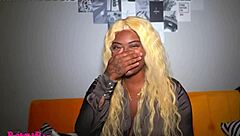 Big cocked black beauty gives a blowjob on couch