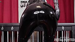 Sensual domination in black pvc pants featuring ass worship