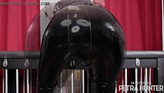 Sensual domination in black pvc pants featuring ass worship