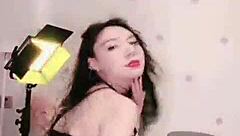 Sensual Asian girl performs a seductive dance on webcam