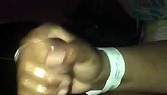 Watch an Ebony babe give a handjob that makes a guy explode