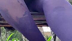 in the spring outdoor air, a woman teases with her mini skirt and nylon pantyhose, showing off her feet while walking