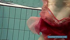 katya okuneva strips in red dress at outdoor pool shower