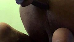 She warms up her ass with a small dildo.