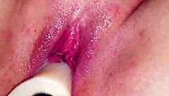 Shaved pussy squirts wet cum on dildo during intense orgasm