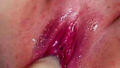 Shaved pussy squirts wet cum on dildo during intense orgasm