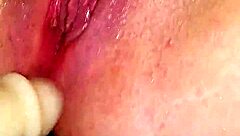 Shaved pussy squirts wet cum on dildo during intense orgasm