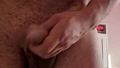 The blonde watches her stud touch himself lightly in this intimate scene.