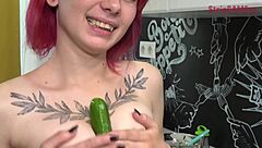 Olivia teases with cucumber in kitchen, performs blowjob on webcam, shows tattoo