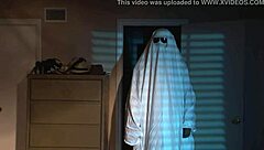 A nude blonde girl celebrates Halloween in bed.