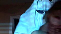 A nude blonde girl celebrates Halloween in bed.