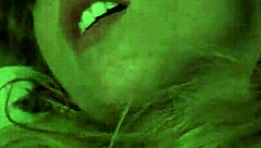 A nude blonde girl celebrates Halloween in bed.