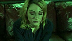 A nude blonde girl celebrates Halloween in bed.