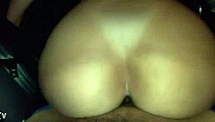 three people in a car with the door open