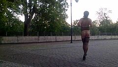 Young and naked shemale in a public setting