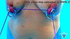 nippleringlover stretches pierced nipples bound in pool