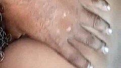 the young woman savors a delicious blowjob in the bedroom, her lips wrapped tightly around the throbbing cock as she takes it deep, moaning softly with each thrust from behind.