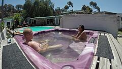 dayanara relaxes naked in the hot tub