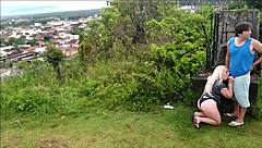 Horny blonde slut sucks African guy's cock on the beach