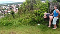 Horny blonde slut sucks African guy's cock on the beach