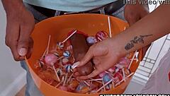 black sausage shaped candies delight the beautiful halloween girl