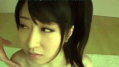 Cute Japanese girl gives a blowjob in voyeuristic video